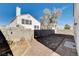 Small backyard with flagstone patio and gravel landscaping at 8214 Mt Brodie Cir, Las Vegas, NV 89145