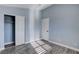 Light blue bedroom with wood-look flooring and double closets at 8214 Mt Brodie Cir, Las Vegas, NV 89145