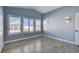 Light and bright bedroom with gray flooring and vaulted ceilings at 8214 Mt Brodie Cir, Las Vegas, NV 89145