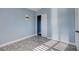 Light blue bedroom with wood-look flooring, closet, and window at 8214 Mt Brodie Cir, Las Vegas, NV 89145