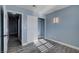 Light blue bedroom with wood-look flooring and access to hallway at 8214 Mt Brodie Cir, Las Vegas, NV 89145