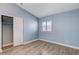 Light and airy bedroom with wood-look floors and a spacious closet at 8214 Mt Brodie Cir, Las Vegas, NV 89145