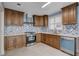 Modern kitchen with stainless steel appliances and stylish backsplash at 8214 Mt Brodie Cir, Las Vegas, NV 89145