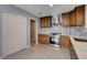 Modern kitchen with stainless steel appliances and wood cabinets at 8214 Mt Brodie Cir, Las Vegas, NV 89145