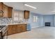 Updated kitchen features wood cabinets and a view into the living room at 8214 Mt Brodie Cir, Las Vegas, NV 89145