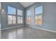 Spacious living room with light gray tile flooring and lots of natural light at 8214 Mt Brodie Cir, Las Vegas, NV 89145