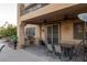 Outdoor patio with built-in grill, dining area, and ceiling fans at 9012 Alpine Peaks Ave, Las Vegas, NV 89147