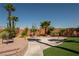 Landscaped backyard with a basketball court and patio area at 9012 Alpine Peaks Ave, Las Vegas, NV 89147