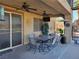 Covered patio with dining table and ceiling fans at 9012 Alpine Peaks Ave, Las Vegas, NV 89147