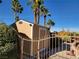 Tan shed with white trim in the backyard at 9012 Alpine Peaks Ave, Las Vegas, NV 89147