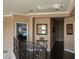 Elegant upstairs hallway with dark hardwood floors and wrought iron railing at 9012 Alpine Peaks Ave, Las Vegas, NV 89147