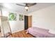 Bedroom with twin bed, full-length mirror, and wood floors at 9157 Chenille Ct, Las Vegas, NV 89149