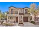 Two-story house with balcony, two-car garage, and landscaped yard at 9157 Chenille Ct, Las Vegas, NV 89149