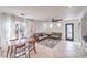 Living room with tiled floor, couches, and a large TV at 9157 Chenille Ct, Las Vegas, NV 89149