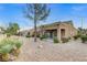 Spacious backyard with gravel and a covered patio at 9452 Gold Mountain Dr, Las Vegas, NV 89134