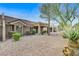 Backyard view of home with gravel and covered patio at 9452 Gold Mountain Dr, Las Vegas, NV 89134