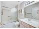 Bathroom with tub shower, vanity, and toilet at 9452 Gold Mountain Dr, Las Vegas, NV 89134