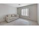 Bedroom with striped couch and window coverings at 9452 Gold Mountain Dr, Las Vegas, NV 89134