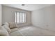 Bedroom with striped couch and window coverings at 9452 Gold Mountain Dr, Las Vegas, NV 89134