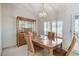 Bright dining room with wood table and chairs, and built-in hutch at 9452 Gold Mountain Dr, Las Vegas, NV 89134