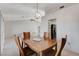 Bright dining room with wood table and chairs, and kitchen view at 9452 Gold Mountain Dr, Las Vegas, NV 89134