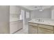 Kitchen with white cabinets, double sink, and tiled floor at 9452 Gold Mountain Dr, Las Vegas, NV 89134