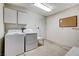 Laundry room with washer, dryer, and cabinets at 9452 Gold Mountain Dr, Las Vegas, NV 89134