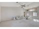 Bright living room with vaulted ceilings, neutral decor, and sliding doors at 9452 Gold Mountain Dr, Las Vegas, NV 89134