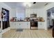 Modern kitchen with white cabinets and stainless steel appliances at 1336 Darmak Dr, Las Vegas, NV 89102