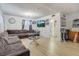 Bright living room with sectional sofa, hardwood floors, and a view of the bathroom at 1336 Darmak Dr, Las Vegas, NV 89102