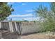 View of a backyard with a block wall and distant stores at 1774 Franklin Chase Ter, Henderson, NV 89012