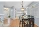 Bright dining area with hardwood floors and a view of the kitchen at 1774 Franklin Chase Ter, Henderson, NV 89012