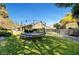 Spacious backyard featuring a trampoline and lush green grass at 2111 Bogart Ct, Las Vegas, NV 89117