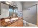 Bright bathroom with a marble countertop vanity, modern lighting and gray painted walls at 2111 Bogart Ct, Las Vegas, NV 89117