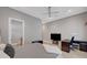 Comfortable bedroom features a ceiling fan, desk, and television at 2111 Bogart Ct, Las Vegas, NV 89117