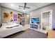 Bedroom with a modern ceiling fan, gray walls and decorated with wall posters at 2111 Bogart Ct, Las Vegas, NV 89117