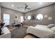 Bedroom with a ceiling fan and a modern interior design with a desk and personal touches at 2111 Bogart Ct, Las Vegas, NV 89117