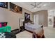 Cozy bedroom features ceiling fan, neutral tones, decor and a seating area at 2111 Bogart Ct, Las Vegas, NV 89117