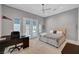 Relaxing bedroom features double doors, ceiling fan and a private outdoor view at 2111 Bogart Ct, Las Vegas, NV 89117