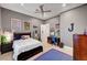 Bedroom with grey painted walls and ceiling fan, with view into bedroom at 2111 Bogart Ct, Las Vegas, NV 89117