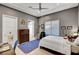 Bedroom featuring a ceiling fan, grey walls and a blue rug on tile flooring at 2111 Bogart Ct, Las Vegas, NV 89117