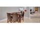 Bright dining area features a wooden table with seating for four, and elegant marble flooring at 2111 Bogart Ct, Las Vegas, NV 89117