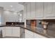 Bright, modern kitchen with white cabinets, stainless steel appliances, and a large island at 2111 Bogart Ct, Las Vegas, NV 89117