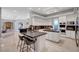Spacious kitchen with custom cabinets, marble countertops, stainless appliances, and center island at 2111 Bogart Ct, Las Vegas, NV 89117