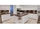 Well-equipped kitchen featuring marble countertops, stainless steel appliances, and custom cabinets at 2111 Bogart Ct, Las Vegas, NV 89117