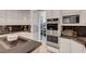Chef's kitchen showcasing a large island, state-of-the-art appliances, and pantry access at 2111 Bogart Ct, Las Vegas, NV 89117