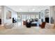 Open-concept living area featuring tile flooring, neutral walls, fireplace and built-ins at 2111 Bogart Ct, Las Vegas, NV 89117