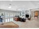 Bright and airy living room with fireplace, plenty of seating and doors to the patio at 2111 Bogart Ct, Las Vegas, NV 89117