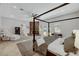 Relax in this main bedroom featuring a fireplace, a seating area, and access to the backyard at 2111 Bogart Ct, Las Vegas, NV 89117