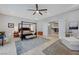 This main bedroom features tray ceilings and access to the ensuite bathroom and kitchen at 2111 Bogart Ct, Las Vegas, NV 89117